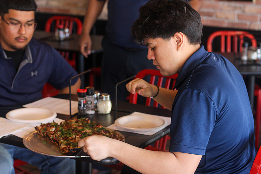 Senior Christopher Morales and junior Oscar Martinez taste tests the "Larry Monster."