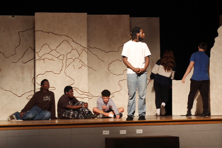 Junior Christian Bowers in character takes care of freshman Hermes Modu, junior Myles Adekoya and sophomore Scott Woodruff.